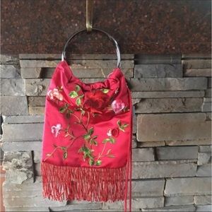 Silky embroidered bracelet bag